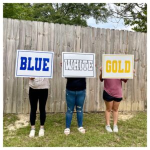 Photographed corrugated cheer sign in use